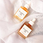 square dropper bottle shimmer body oil gold and bronze